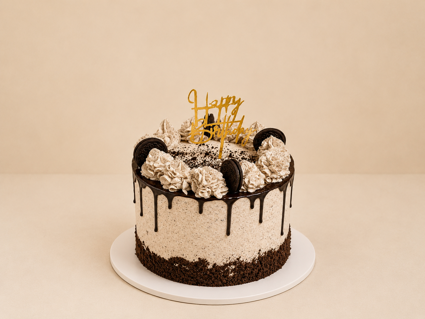 Oreo cookies-and-cream drip birthday cake with chocolate ganache drip, Oreo crumbles, and Happy Birthday topper by Cakes by Teez in Abuja